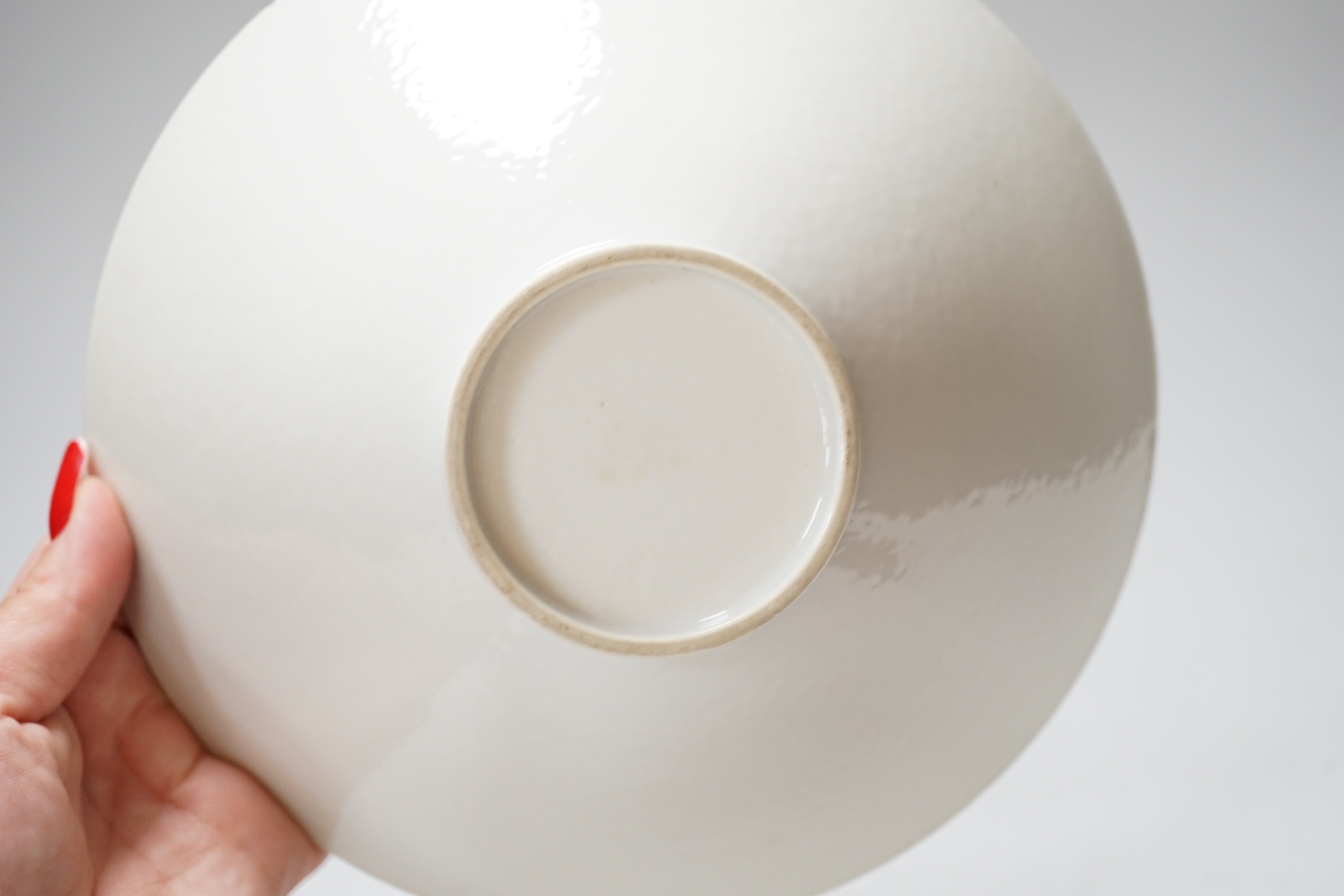 A Chinese white Anhua decorated conical dish, 20cm